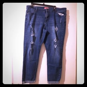 Medium denim wash jeans with distressed cuts